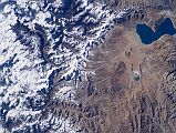 Shishapangma 02 01 Nasa ISS006-E-13650 From Above Nasa has some excellent photos of Shishapangma and the surrounding mountains. ISS006-E-13650 was taken on 2002-12-28. Peiku Tso is in the upper right and Shishapangma in the centre. The trekking route from Nyalam to the Southwest face is clearly visible in the lower left.